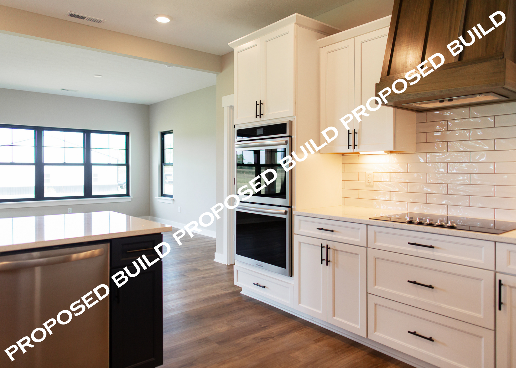 Kitchen with white subway tiles, creamy white cabinets, and black hardware